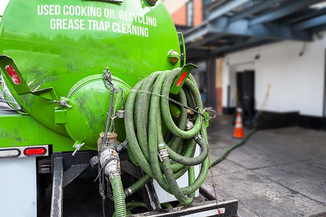 a grease trap being pumped by a sanitation technician in South El Monte, CA